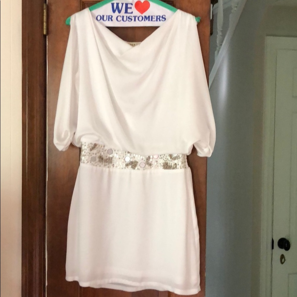 Flattering white cinched dress with detail